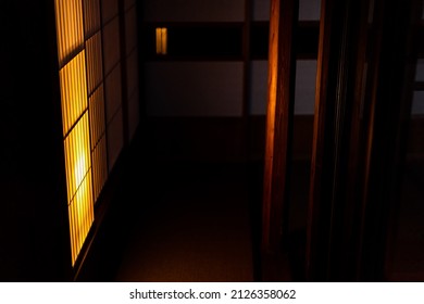 Traditional Japanese Machiya House Or Ryokan Restaurant At Dark Evening Night With Illuminated Yellow Light Lamp Shoji Sliding Paper Door Nobody In Hall