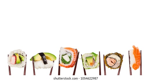 Traditional japanese sushi pieces placed between chopsticks, separated on white background. Very high resolution image.
