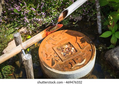 Traditional japanese water fountain shishi-odoshi  in garden