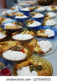 Traditional Javanese Rice Dish Complete With Spring Rolls, Noodles And Vegtables.  