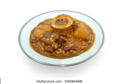 Traditional Jewish Cholent (Hamin) prepared is Israel as the main dish for the Shabbat meal made with beef, potato, beans, barley, and more and served with horseradish sauce