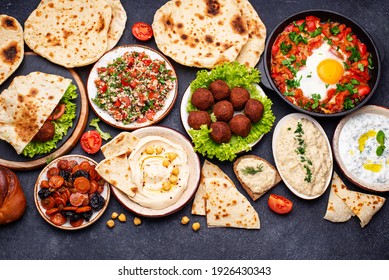 Traditional Jewish food. Hummus, falafel, shakshuka, tsimes, forshmak and pita