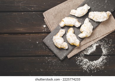 Traditional Jewish Rugelach Or Kifli Crescent Rolled Cookies Covered With Sugar Icing. Freshly Home Baked Shortcrust Pastry Croissants Confection