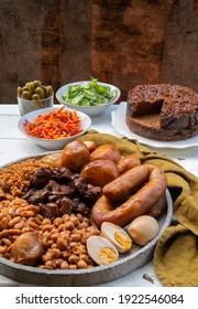 Traditional Jewish Shabbat  Meal (Cholent Hamin) Slow Cooked Beef, Potato, Beans, Brown Eggs, Wheat, Chick Pea And Onion, Served With Salads, Pickles And Jewish Dish (kugel) Made Of Pasta