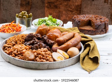 Traditional Jewish Shabbat  Meal (Cholent Hamin) Slow Cooked Beef, Potato, Beans, Brown Eggs, Wheat, Chick Pea And Onion, Served With Salads, Pickles And Jewish Dish (kugel) Made Of Pasta