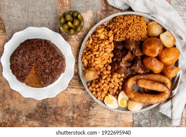 Traditional Jewish Shabbat  Meal (Cholent Hamin) Slow Cooked Beef, Potato, Beans, Brown Eggs, Wheat, Chick Pea And Onion, Served With Pickles And Jewish Dish (kugel) Made Of Pasta