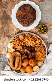 Traditional Jewish Shabbat  Meal (Cholent Hamin) Slow Cooked Beef, Potato, Beans, Brown Eggs, Wheat, Chick Pea And Onion, Served With Pickles And Jewish Dish (kugel) Made Of Pasta