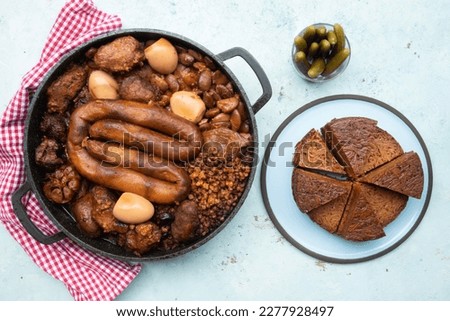Traditional Jewish Shabbat  Meal (Cholent Hamin) slow cooked beef, chicken, potato, beans, brown eggs, wheat, and onion