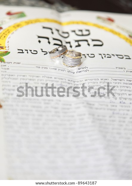 Traditional jewish wedding, signing\
prenuptial agreement  ketubah. Jewish marriage\
contract.
