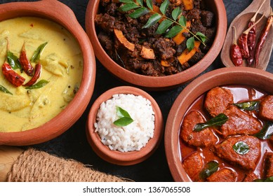 Traditional Kerala rice with side dish yellow mango curry, fish curry, beef roast Kerala India. Made from organic raw ripe mango, coconut milk, seasoned with curry leaves, Indian red Kashmir chilli. - Powered by Shutterstock