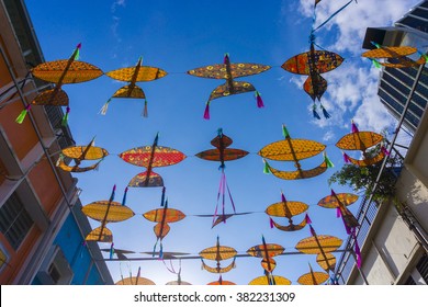 traditional kite variety of patterns and shapes on the wall along the road