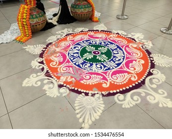 Traditional Kolam. Kolam is a form of drawing that is drawn by using rice flour, chalk, chalk powder or rock powder, often using naturally or synthetically colored powders. 
