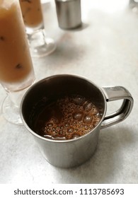 Traditional Kopitiam (or Kopi Tiam) Style Milk Coffee In Metal Cup.