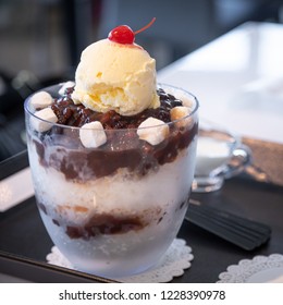 Traditional Korean Patbingsu dessert, topped by vanilla ice cream and sweet red bean paste - Powered by Shutterstock