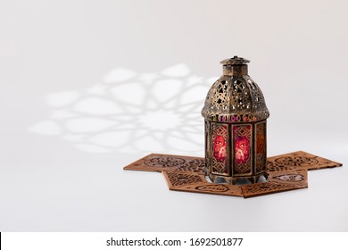 Traditional Lantern And Wooden Pattern Decorating The Ground Around It,  With Arabesque Shadow On Background