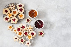 Traditional Linzer Christmas Cookies Filled With Lingonberry Jam And Orange Jam On Wooden Background