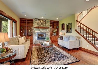 Traditional Living Room With Decorative Rug And Hardwood Floor.