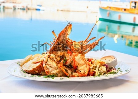 Traditional lobster dish served at seaside taverna in Rethymno. Crete, Greece