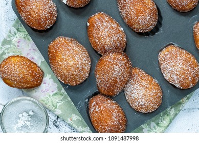 Traditional Madeleines Cakes Dusted With Icing Sugar - Overhead View