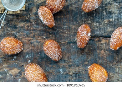 Traditional Madeleines Cakes Dusted With Icing Sugar - Overhead View