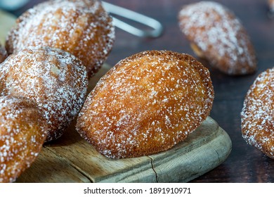 Traditional Madeleines cakes dusted with icing sugar