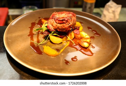 Traditional Main Course Of Sauteed Reindeer With Mashed Potatoes And Cranberries In Finland