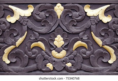 A Traditional Malay Exotic Floral Wood Carving On A Wooden Penal With Gold Leaf.