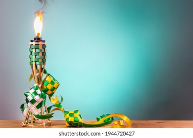 Traditional Malay Torch And Decorative Ketupat Lit Up During Hari Raya Aidilfitri Celebration