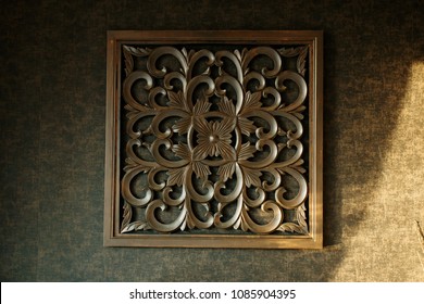 Traditional Malay Wood Carving Decoration Hanging On A Wall