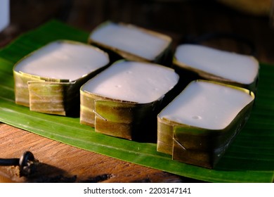 Traditional Malaysian Deasert Called Kuih Tepung Pelita Or Kuih Tako A Dark Background. Coconut Milk And Flour Prepared In Banana Leaves. Popular During Fasting Month Ramadan