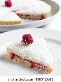 Traditional Manchester Tart On White Marble With Raspberries And Coconut