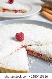 Traditional Manchester Tart On White Marble With Raspberries And Coconut