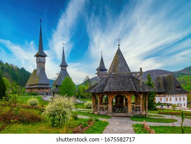 Traditional Maramures wooden architecture of Barsana monastery, Romania. Picturesque sky