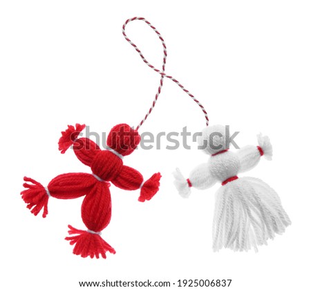 Traditional martisor shaped as man and woman on white background. Beginning of spring celebration