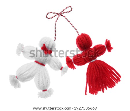 Traditional martisor shaped as man and woman on white background. Beginning of spring celebration