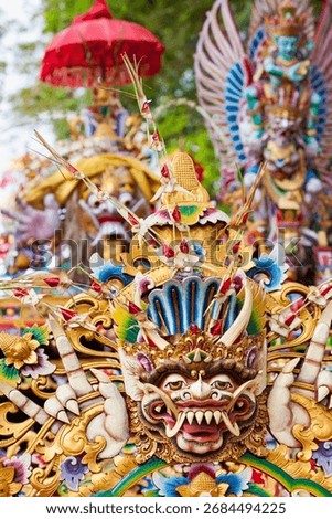 Traditional mask pattern in temple - protective spirit, Bali island symbol. Featured in Balinese architecture. Culture, religion, arts of Indonesian people. Travel background,