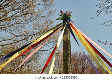 A traditional maypole dance during a May Day celebration