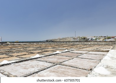 Traditional methods of sea salt production in Salinas del Carmen, Fuerteventura. Production from ocean water. - Shutterstock ID 637505701