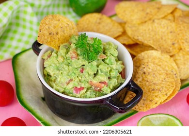 Traditional Mexican avocado salad dip Guacamole served with tortilla chips - Shutterstock ID 2206305621
