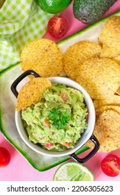 Traditional Mexican avocado salad dip Guacamole served with tortilla chips - Shutterstock ID 2206305623