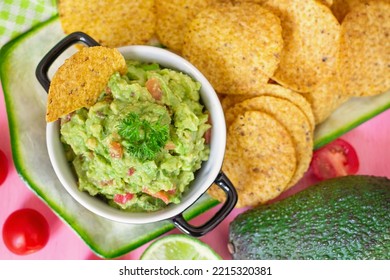Traditional Mexican avocado salad dip Guacamole served with tortilla chips - Shutterstock ID 2215320381