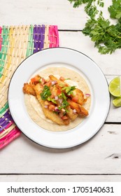 Traditional mexican breaded fish tacos also called ensenada on white background