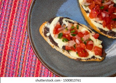 Traditional Mexican Breakfast Of Molletes Served In Mexico City (Overhead)