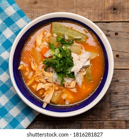 Traditional Mexican Chicken Soup With Vegetables And Rice On Wooden Background