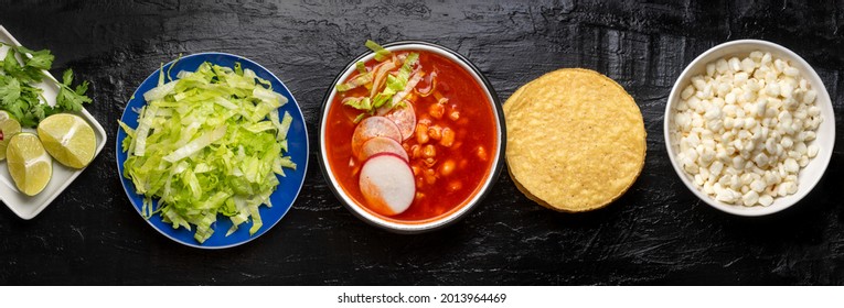 Traditional mexican food. Red pozole with chicken on dark background