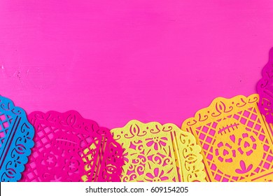 Traditional Mexican Papel Picado Paper Banner On A Wood Background.