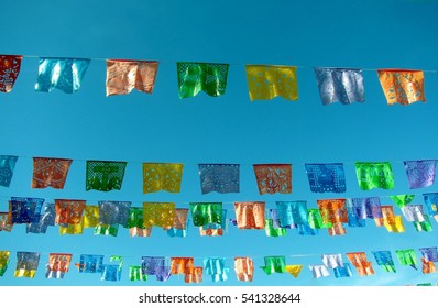 Traditional Mexican Paper Bunting Decoration Celebratory Flags Against Blue Sky