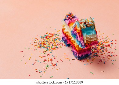 Traditional mexican pony pinata (piñata) craft made of paper for birthday or cinco de mayo celebrations and sprinkles thrown on the side. Space available for text in cards, stationary or invitations.