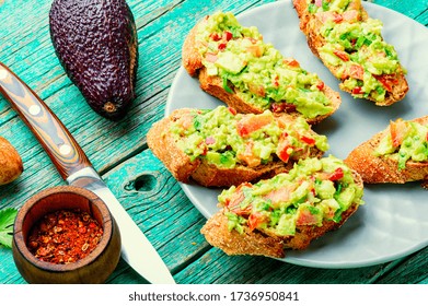 Traditional mexican sauce guacamole and avocado sandwiches - Powered by Shutterstock