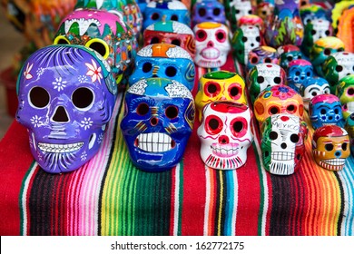 Traditional Mexican Souvenir Skulls On The Market. Travel Background For Mexico, Latin America.